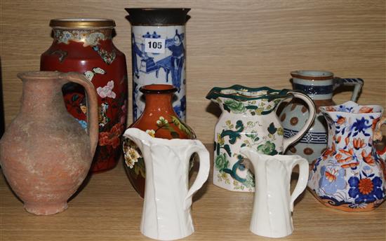 Two Oriental vases and seven jugs